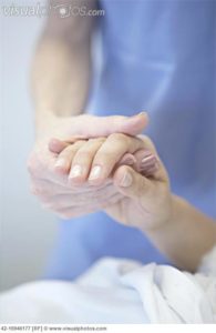 Nurse Holding Patient's Hand